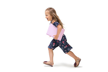 Image showing Smiling cute toddler girl three years running over white background