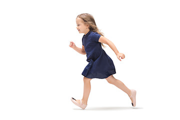 Image showing Smiling cute toddler girl three years running over white background