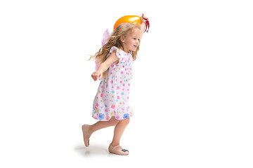 Image showing Smiling cute toddler girl three years running over white background