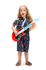 Image showing Smiling cute toddler girl three years singing over white background