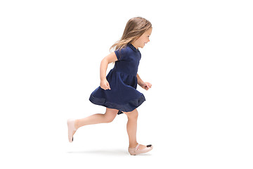 Image showing Smiling cute toddler girl three years running over white background