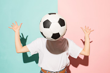 Image showing The young fan with ball instead of head on blue and pink trendy colors.