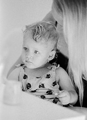 Image showing Black and white portrait of baby girl with mum at home