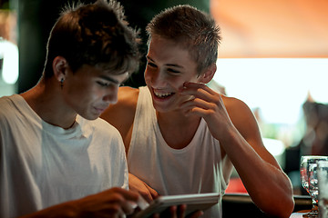 Image showing Young boys in a cafe