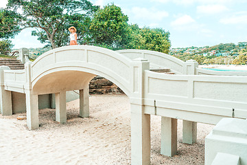 Image showing Woman standing on arched bridge at Balmoral Beach