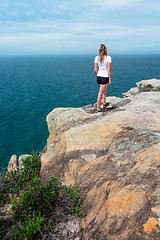 Image showing Woman gazing out from the cliff top views Royal National Park