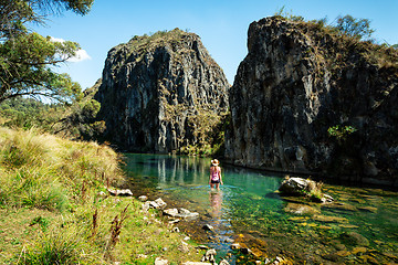 Image showing Woman wading in  one of the spectacular gorges of Snowy Mountains Australia