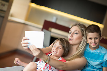 Image showing Young Family Using A Tablet To Make Future Plans