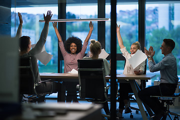 Image showing multiethnic Group of young business people throwing documents