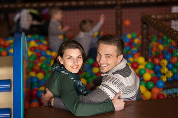 Image showing young parents with kids in a children\'s playroom