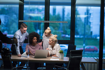 Image showing Multiethnic startup business team in night office