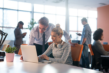 Image showing Two Business People Working With laptop in office