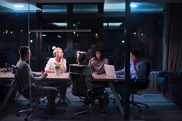 Image showing Multiethnic startup business team in night office