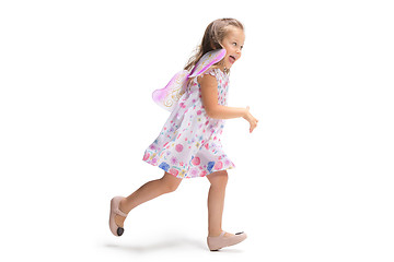 Image showing Smiling cute toddler girl three years running over white background