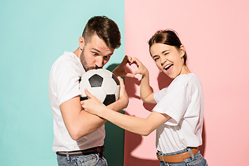 Image showing The young fans celebrating on blue and pink trendy colors.