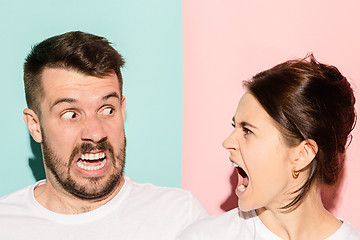 Image showing attractive angry couple fighting and shouting at each other