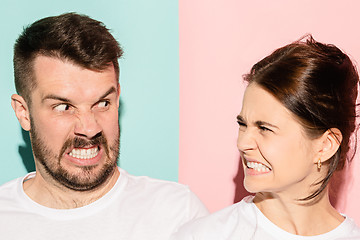 Image showing attractive angry couple fighting and shouting at each other