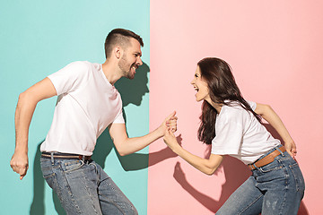 Image showing A couple of young man and woman dancing hip-hop at studio.