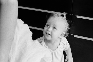 Image showing Home portrait of baby girl in black and white