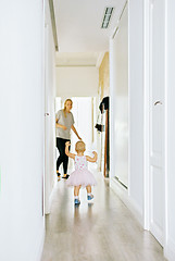 Image showing First steps of a little girl