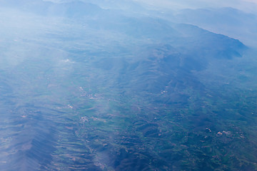 Image showing Mountain view from an airplane window.