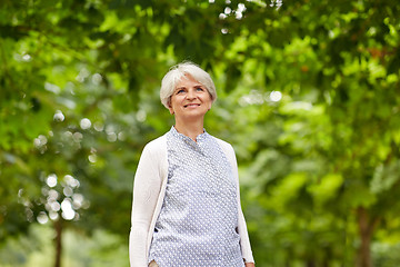 Image showing happy senior woman at summer park