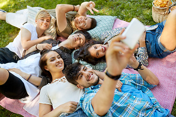 Image showing friends taking selfie on picnic at summer park