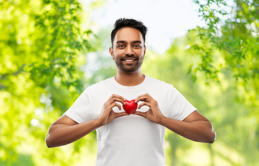 Image showing indian man with red heart over natural background