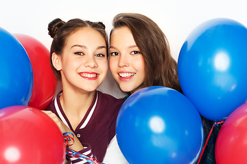 Image showing happy teenage girls with helium balloons