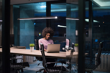 Image showing black businesswoman using a laptop in startup office