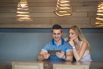 Image showing couple using tablet at home