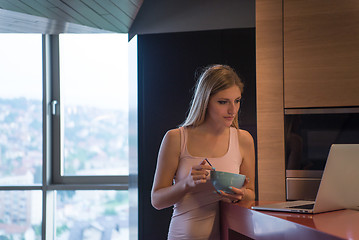 Image showing woman eating breakfast enjoying relaxing lifestyle