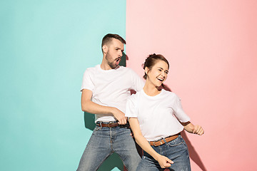 Image showing A couple of young man and woman dancing hip-hop at studio.