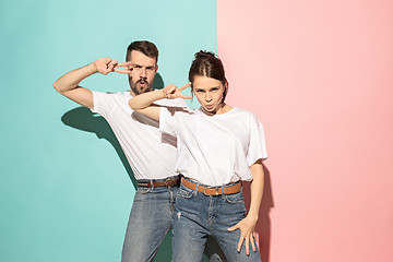 Image showing A couple of young man and woman dancing hip-hop at studio.