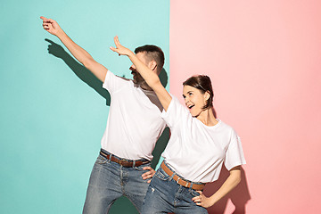 Image showing A couple of young man and woman dancing hip-hop at studio.