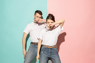 Image showing A couple of young man and woman dancing hip-hop at studio.