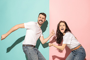 Image showing A couple of young man and woman dancing hip-hop at studio.