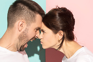 Image showing attractive angry couple fighting and shouting at each other