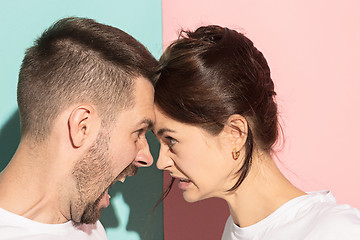 Image showing attractive angry couple fighting and shouting at each other