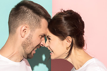 Image showing attractive angry couple fighting and shouting at each other