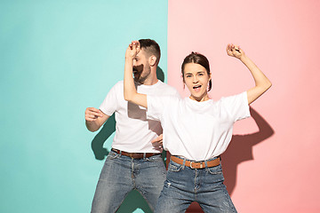 Image showing A couple of young man and woman dancing hip-hop at studio.