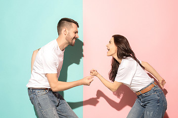 Image showing A couple of young man and woman dancing hip-hop at studio.