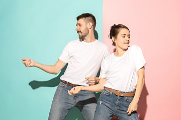 Image showing A couple of young man and woman dancing hip-hop at studio.