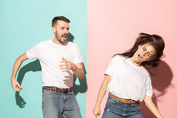 Image showing A couple of young man and woman dancing hip-hop at studio.