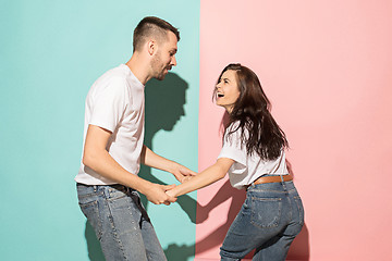 Image showing A couple of young man and woman dancing hip-hop at studio.