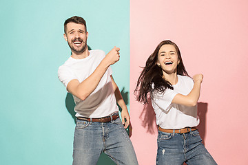 Image showing A couple of young man and woman dancing hip-hop at studio.