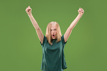 Image showing Winning success woman happy ecstatic celebrating being a winner. Dynamic energetic image of female model