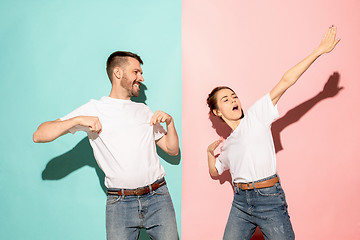 Image showing A couple of young man and woman dancing hip-hop at studio.