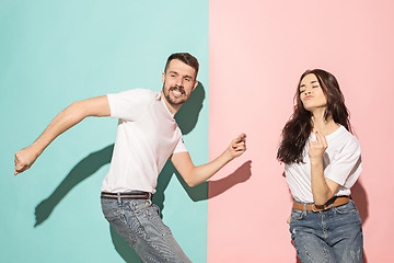 Image showing A couple of young man and woman dancing hip-hop at studio.