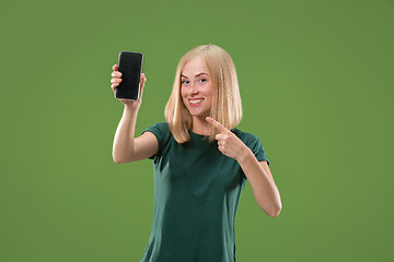 Image showing Portrait of a confident casual girl showing blank screen mobile phone